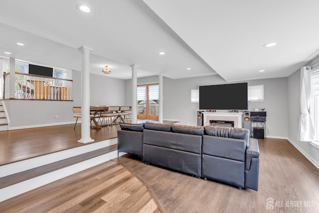 17 Thomas Rd, East Brunswick, NJ 08816 - living area with wood finished floors, decorative columns, baseboards, and recessed lighting