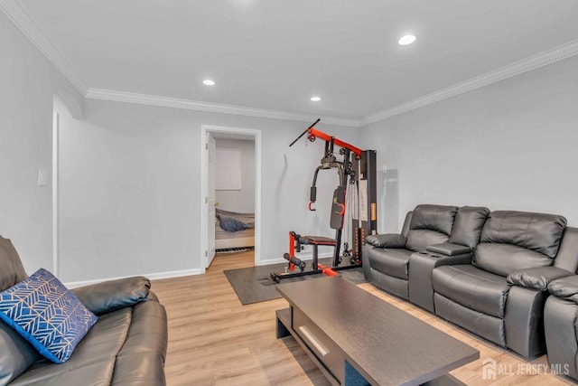 living room featuring crown molding, baseboards, recessed lighting, and light wood-type flooring