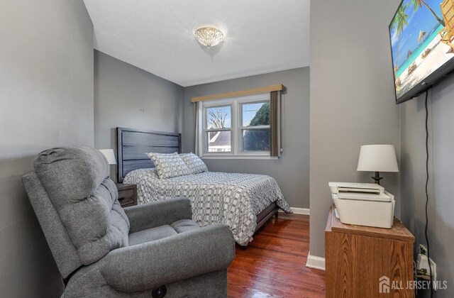 1565 W 6th St, Piscataway, NJ 08854 - bedroom featuring dark wood finished floors and baseboards