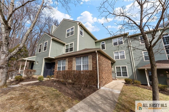 view of front of house featuring brick siding