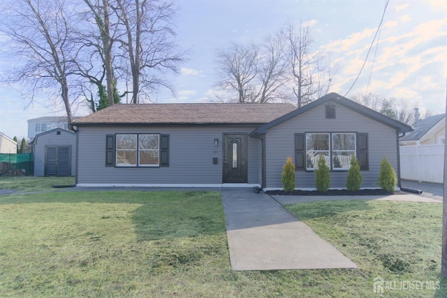 ranch-style home featuring a front yard