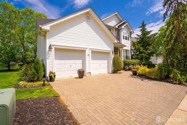 16 Baltusrol Ct, Monroe, NJ 08831 - traditional-style home featuring an attached garage and decorative driveway