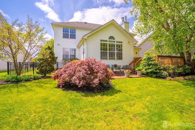16 Baltusrol Ct, Monroe, NJ 08831 - rear view of property with a chimney, a deck, and a patio