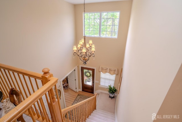 16 Baltusrol Ct, Monroe, NJ 08831 - entryway featuring a chandelier, light wood-style flooring, and a high ceiling