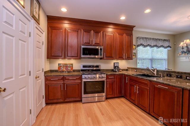 16 Baltusrol Ct, Monroe, NJ 08831 - kitchen with appliances with stainless steel finishes, a sink, light wood finished floors, dark stone countertops, and recessed lighting