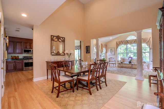 16 Baltusrol Ct, Monroe, NJ 08831 - dining room with ornate columns, light wood finished floors, a high ceiling, baseboards, and recessed lighting