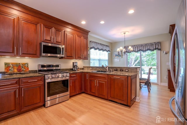 16 Baltusrol Ct, Monroe, NJ 08831 - kitchen featuring appliances with stainless steel finishes, a sink, light wood finished floors, a peninsula, and recessed lighting