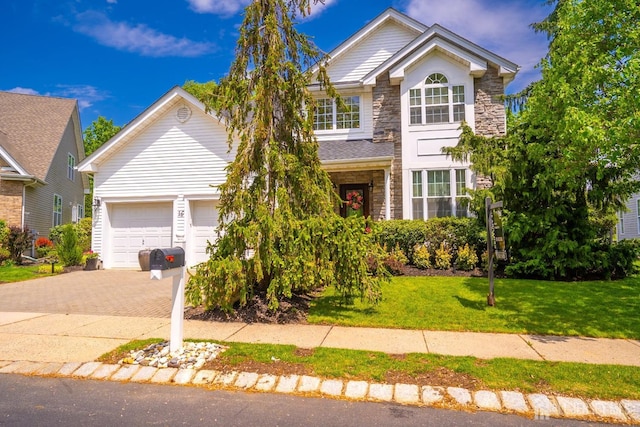16 Baltusrol Ct, Monroe, NJ 08831 - traditional home featuring stone siding, decorative driveway, and a front lawn
