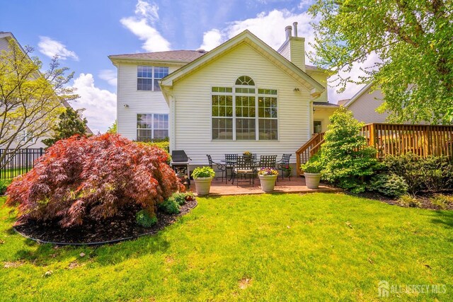 16 Baltusrol Ct, Monroe, NJ 08831 - back of property with a chimney, a wooden deck, and a patio