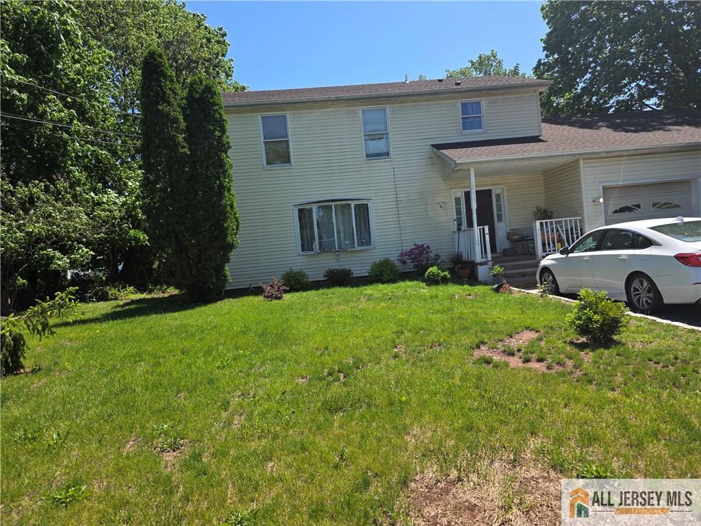518 Wheeler Pl, Franklin, NJ 08873 - view of front of house with a garage and a front lawn