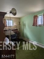bedroom featuring baseboards