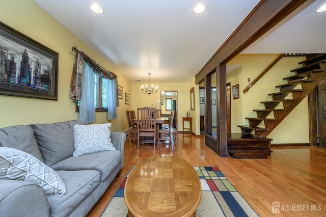 22 Roosevelt St, Pequannock, NJ 07440 - living area featuring a chandelier, light wood-style flooring, stairs, and recessed lighting