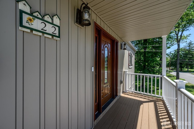 22 Roosevelt St, Pequannock, NJ 07440 - property entrance with board and batten siding and a porch