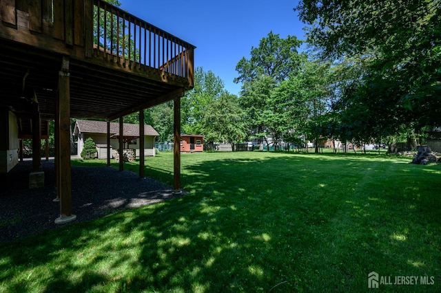 22 Roosevelt St, Pequannock, NJ 07440 - view of grassy yard with a deck
