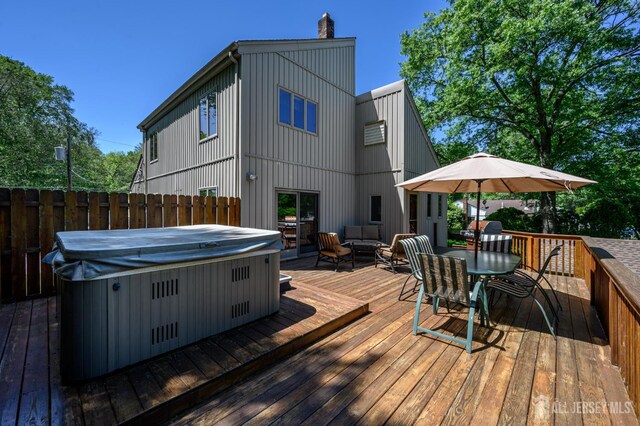 22 Roosevelt St, Pequannock, NJ 07440 - deck with a hot tub and outdoor dining space