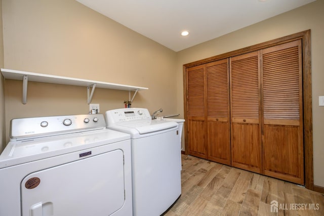 22 Roosevelt St, Pequannock, NJ 07440 - laundry area with washer and clothes dryer, light wood finished floors, and recessed lighting