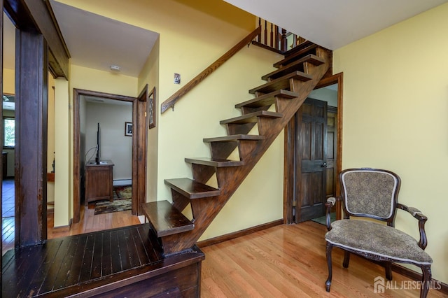 22 Roosevelt St, Pequannock, NJ 07440 - staircase featuring wood finished floors, a baseboard radiator, and baseboards