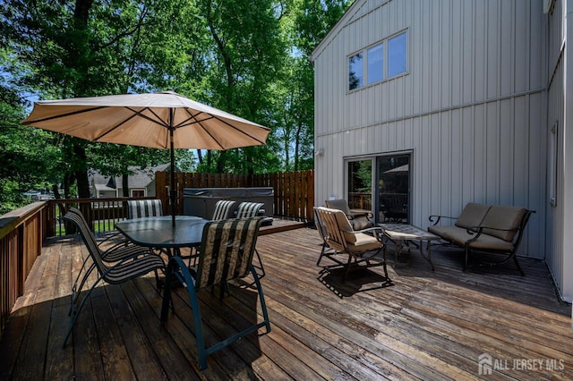 22 Roosevelt St, Pequannock, NJ 07440 - wooden deck with a hot tub and outdoor dining space