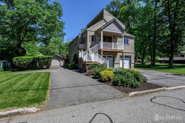 22 Roosevelt St, Pequannock, NJ 07440 - view of front of home featuring asphalt driveway, stairs, a front lawn, and an attached garage