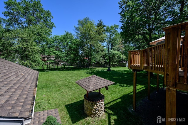 22 Roosevelt St, Pequannock, NJ 07440 - view of yard with a wooden deck and view of scattered trees