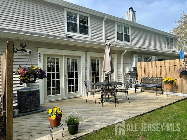 271 Constitution Cir, North Brunswick, NJ 08902 - deck featuring cooling unit, french doors, outdoor dining area, and fence