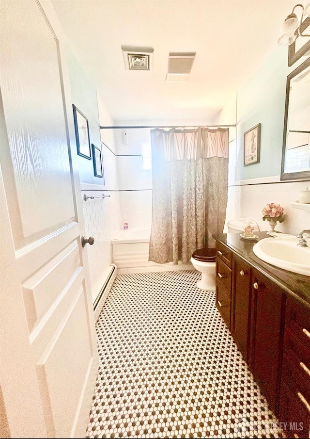 121 Beech St, Fords, NJ 08863 - full bathroom with baseboard heating, toilet, shower / bath combination with curtain, and vanity