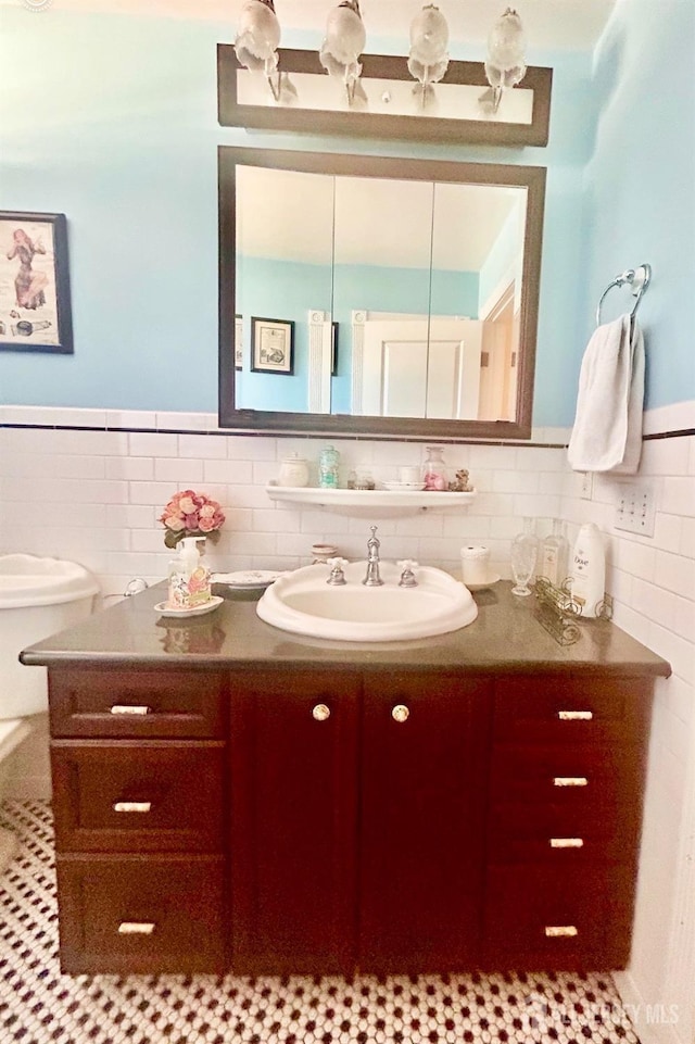 121 Beech St, Fords, NJ 08863 - bathroom featuring vanity, a wainscoted wall, and tile walls