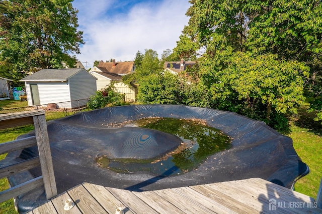 view of swimming pool featuring a deck