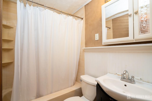 full bathroom with vanity, toilet, and shower / bath combo with shower curtain