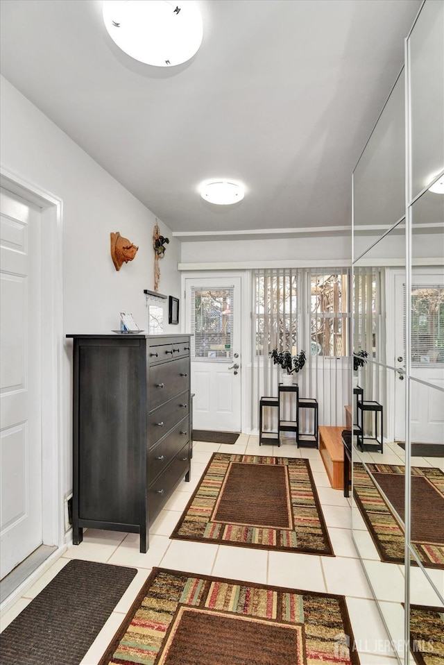 foyer entrance featuring light tile patterned floors