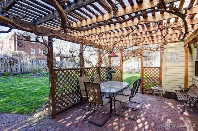 view of patio with outdoor dining area and a pergola