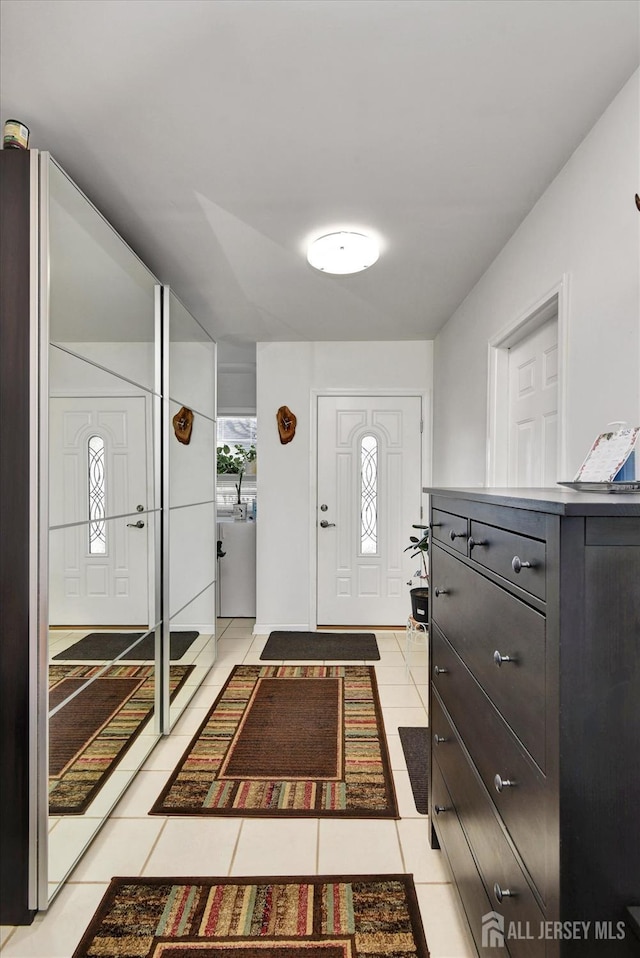entrance foyer with light tile patterned floors