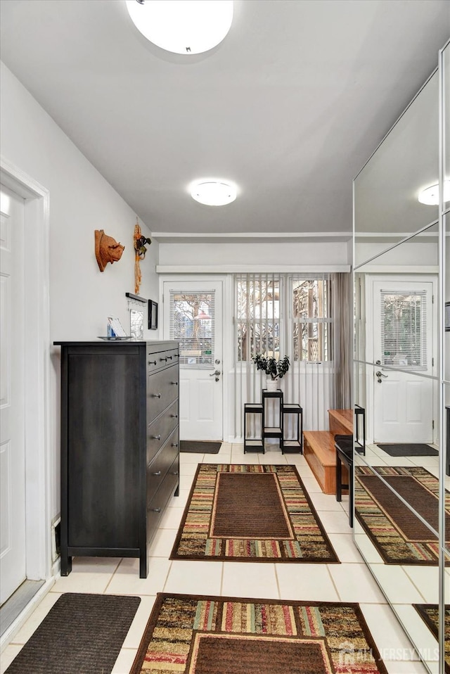 entryway featuring light tile patterned floors