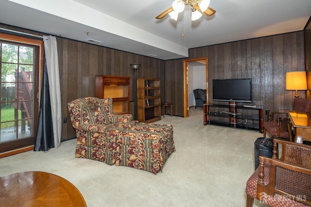 114 Redwood Ave, Edison, NJ 08817 - living room featuring light carpet, wood walls, and ceiling fan
