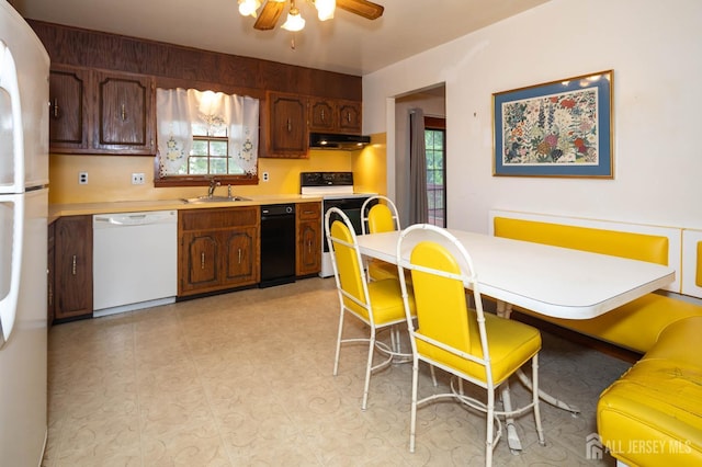 114 Redwood Ave, Edison, NJ 08817 - kitchen with white appliances, under cabinet range hood, a sink, light countertops, and ceiling fan