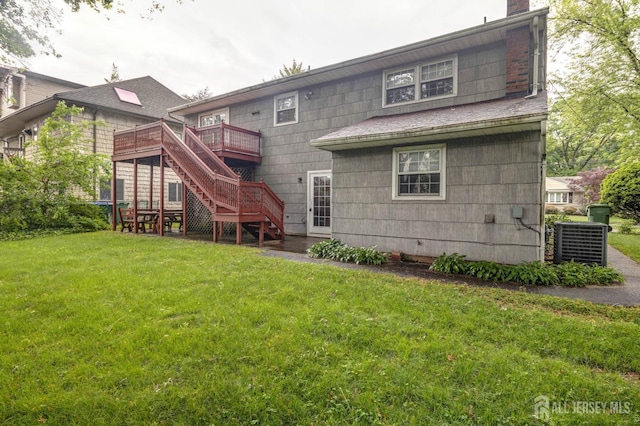 114 Redwood Ave, Edison, NJ 08817 - back of property with stairs, a deck, a yard, a chimney, and central air condition unit
