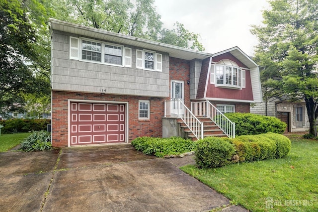 114 Redwood Ave, Edison, NJ 08817 - raised ranch with an attached garage, brick siding, and concrete driveway