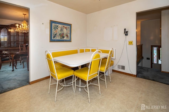 114 Redwood Ave, Edison, NJ 08817 - dining space featuring a chandelier, baseboards, and carpet floors
