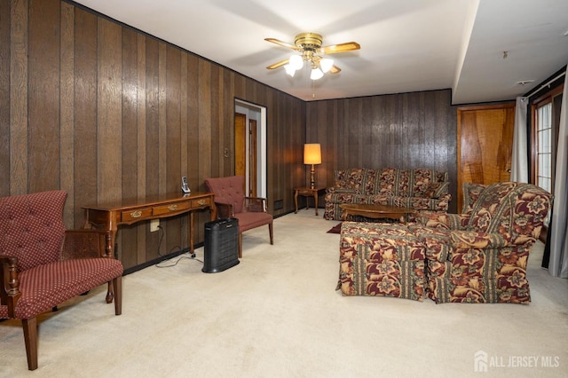 114 Redwood Ave, Edison, NJ 08817 - living area with light colored carpet, a ceiling fan, and wood walls