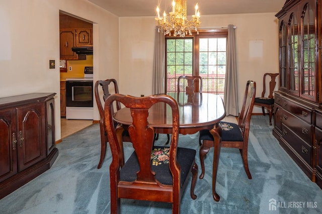 114 Redwood Ave, Edison, NJ 08817 - dining room with dark colored carpet and a chandelier