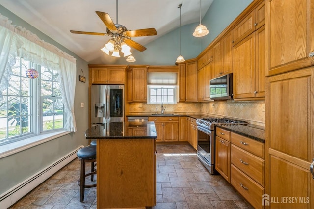 1430 Seneca Rd, North Brunswick, NJ 08902 - kitchen with appliances with stainless steel finishes, baseboard heating, a sink, stone tile floors, and vaulted ceiling