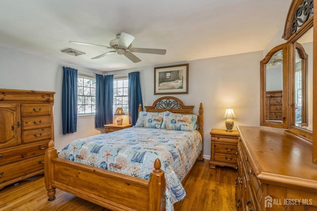 1430 Seneca Rd, North Brunswick, NJ 08902 - bedroom featuring wood finished floors, a ceiling fan, and baseboards