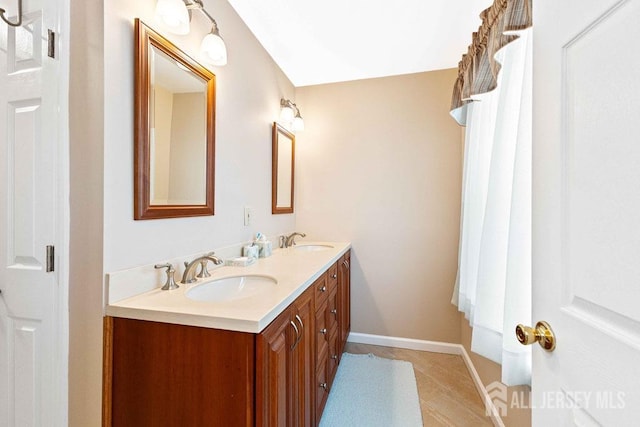 bathroom featuring vanity and tile patterned flooring