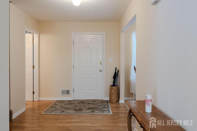 foyer entrance featuring light wood-type flooring