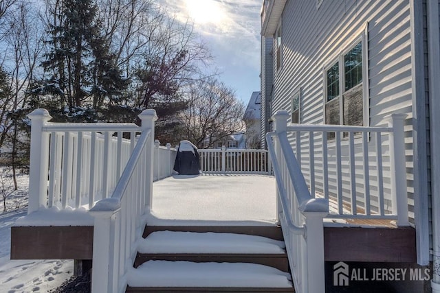 view of snow covered deck