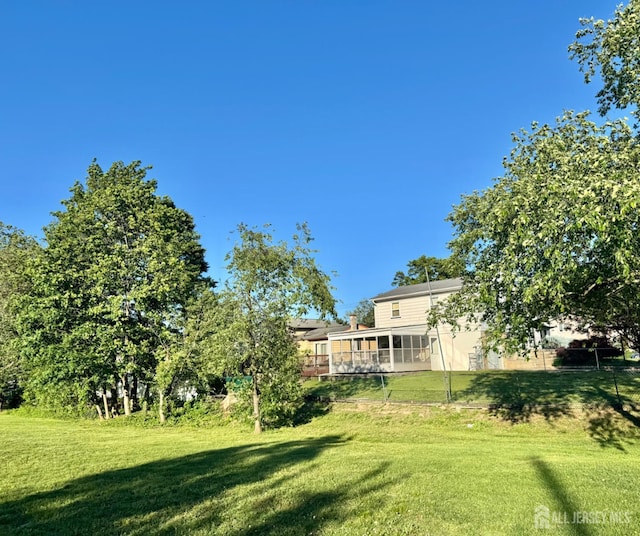 1 Oak St, South River, NJ 08882 - view of green lawn featuring a sunroom