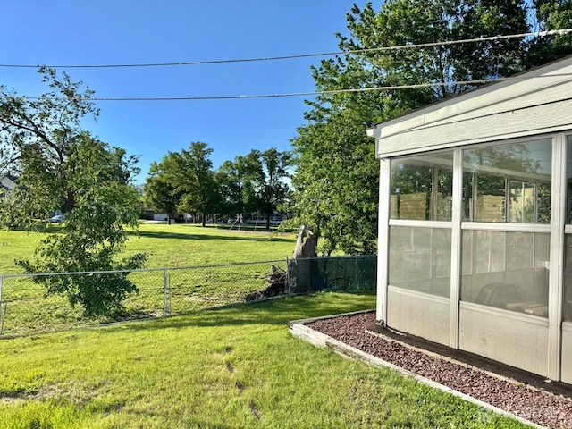 view of yard with a sunroom