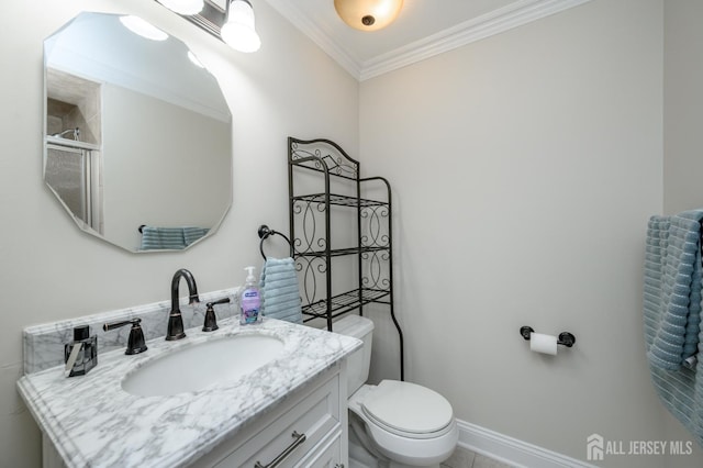 bathroom with ornamental molding, toilet, vanity, and an enclosed shower