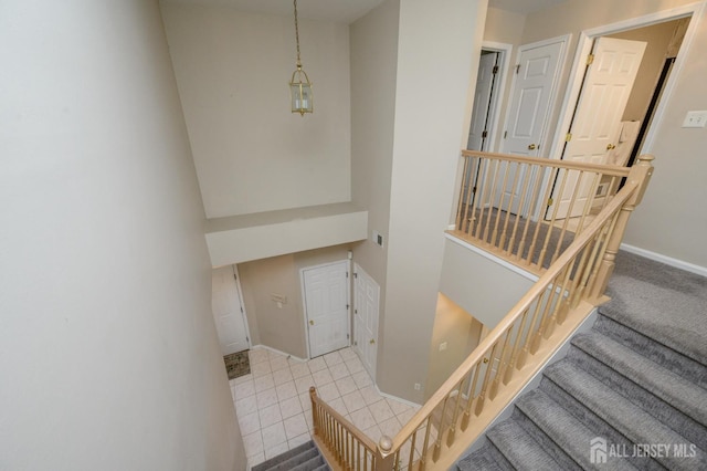 stairway featuring baseboards
