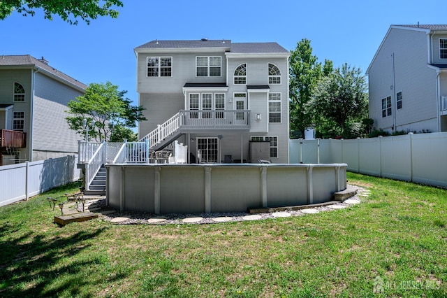 back of house with stairs and a wooden deck